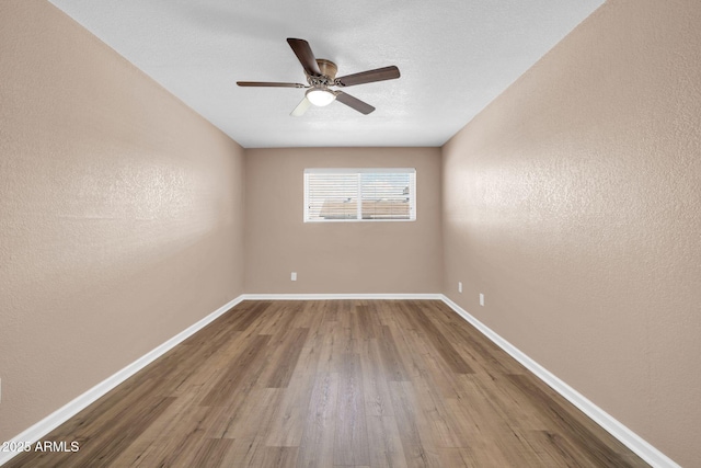 9639 W Cinnabar Ave Unit A, Peoria, AZ 85345 - unfurnished room featuring wood finished floors, ceiling fan, and baseboards