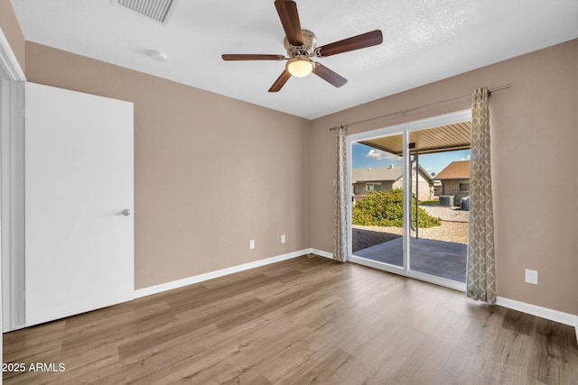 9639 W Cinnabar Ave Unit A, Peoria, AZ 85345 - spare room with wood finished floors, baseboards, and ceiling fan