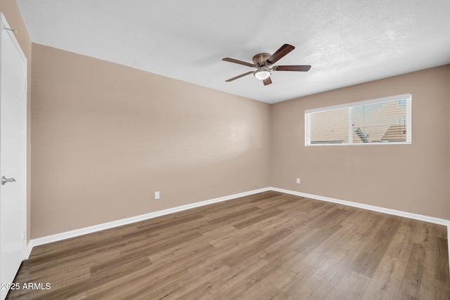 9639 W Cinnabar Ave Unit A, Peoria, AZ 85345 - spare room featuring ceiling fan, wood finished floors, and baseboards