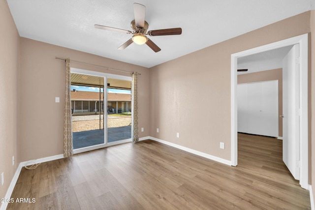 9639 W Cinnabar Ave Unit A, Peoria, AZ 85345 - empty room with a ceiling fan, wood finished floors, and baseboards