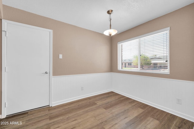 9639 W Cinnabar Ave Unit A, Peoria, AZ 85345 - empty room featuring a wainscoted wall and wood finished floors