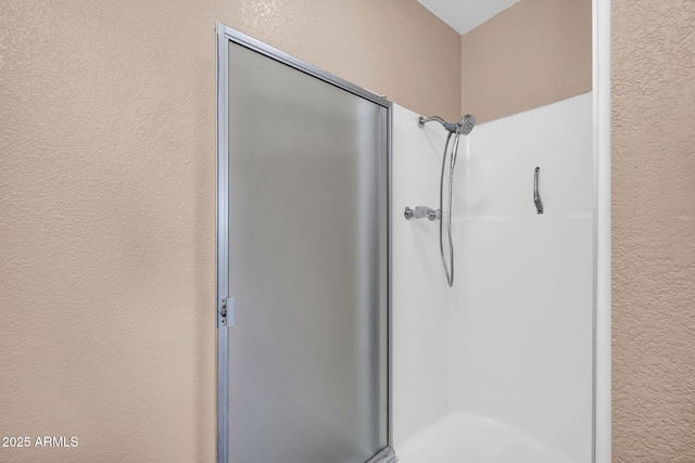 9639 W Cinnabar Ave Unit A, Peoria, AZ 85345 - full bath with a textured wall and a stall shower