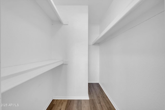 9639 W Cinnabar Ave Unit A, Peoria, AZ 85345 - walk in closet with dark wood finished floors