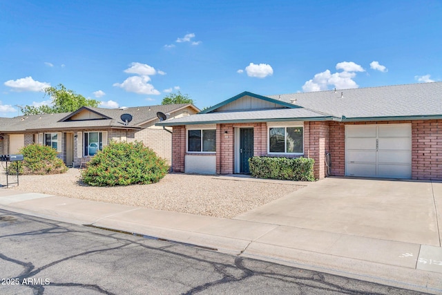 9639 W Cinnabar Ave Unit A, Peoria, AZ 85345 - ranch-style house with brick siding, concrete driveway, and a garage
