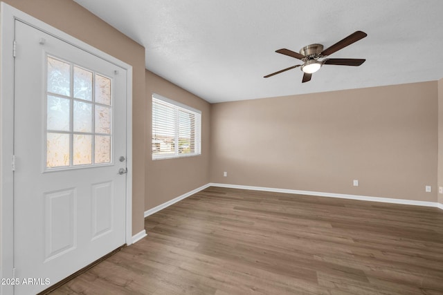 9639 W Cinnabar Ave Unit A, Peoria, AZ 85345 - foyer featuring a ceiling fan, wood finished floors, and baseboards