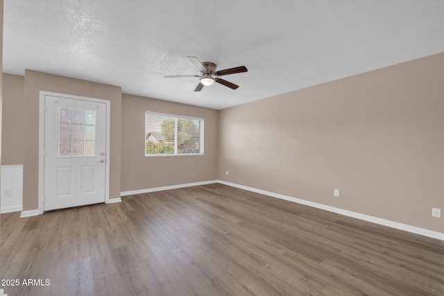 9639 W Cinnabar Ave Unit A, Peoria, AZ 85345 - spare room featuring a ceiling fan, wood finished floors, baseboards, and a textured ceiling