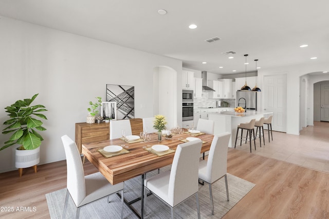 dining room featuring light hardwood / wood-style flooring