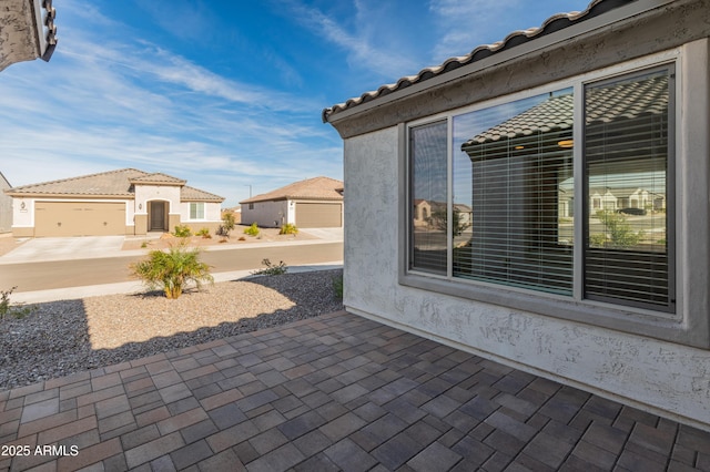 view of patio / terrace with a garage