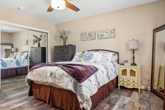 bedroom featuring a closet, dark hardwood / wood-style flooring, and ceiling fan