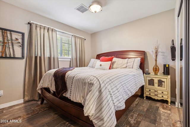 bedroom featuring dark wood-type flooring