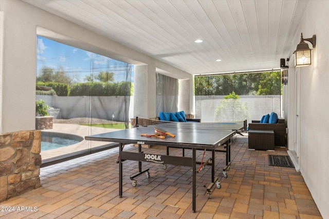 view of patio / terrace featuring an outdoor hangout area and a fenced in pool