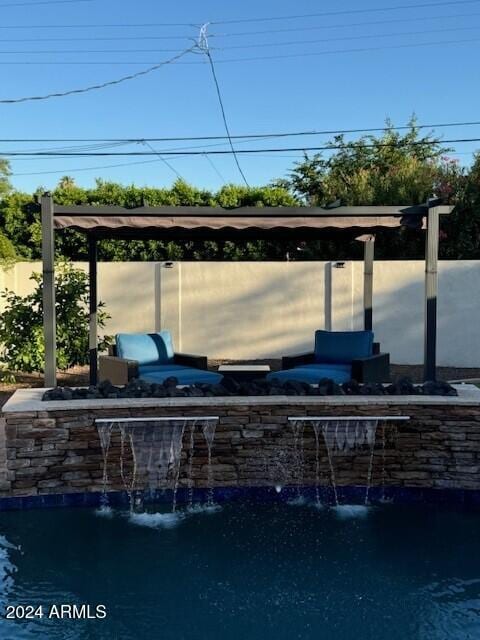 view of patio with pool water feature