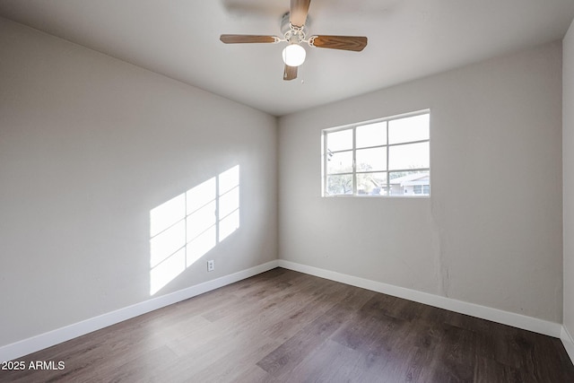 spare room featuring ceiling fan and hardwood / wood-style flooring