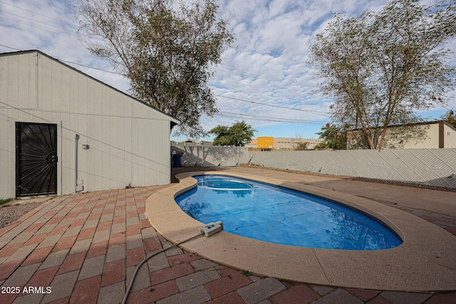 view of swimming pool with a patio area