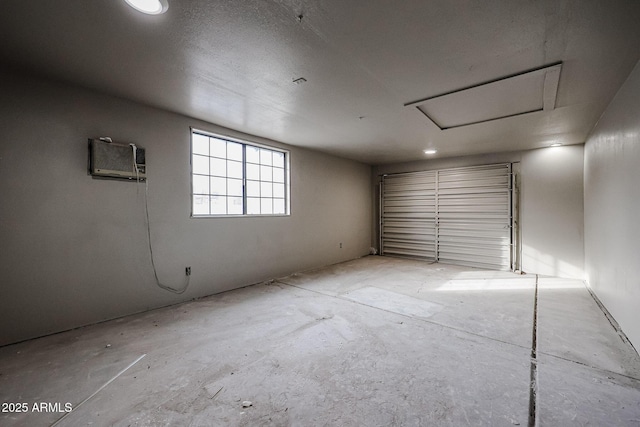 garage with a wall mounted air conditioner