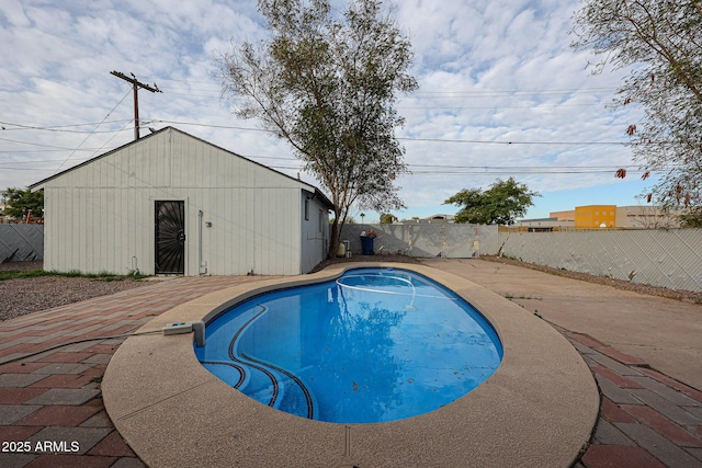 view of swimming pool with a patio