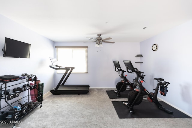 exercise area with light colored carpet and ceiling fan