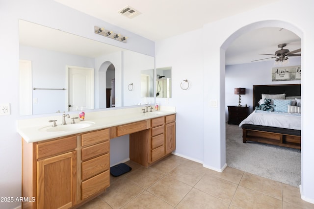 bathroom featuring vanity, tile patterned flooring, and ceiling fan