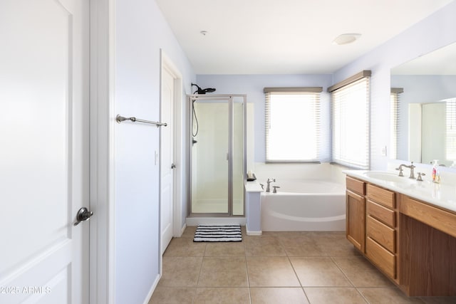 bathroom featuring vanity, tile patterned floors, and separate shower and tub