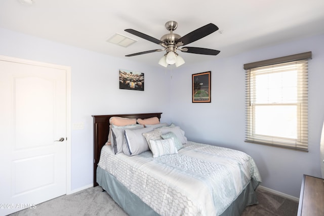 bedroom with light colored carpet and ceiling fan