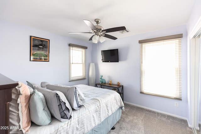 carpeted bedroom with ceiling fan