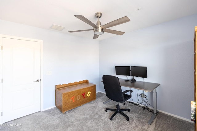 carpeted office space with ceiling fan