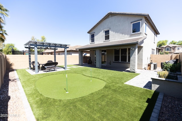 rear view of property with cooling unit, a patio area, and a pergola