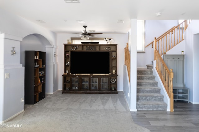 living room featuring hardwood / wood-style flooring and ceiling fan