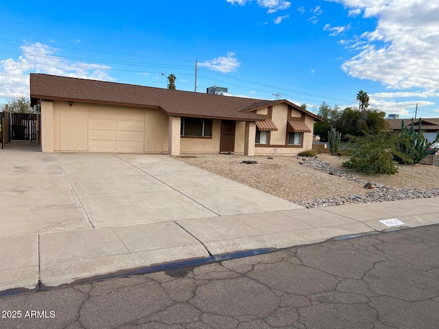 ranch-style home with a garage