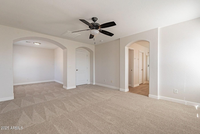 18123 W Lundberg St, Surprise, AZ 85388 - empty room featuring a ceiling fan, light colored carpet, and baseboards