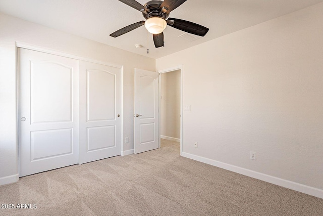 18123 W Lundberg St, Surprise, AZ 85388 - unfurnished bedroom featuring carpet flooring, baseboards, a closet, and a ceiling fan