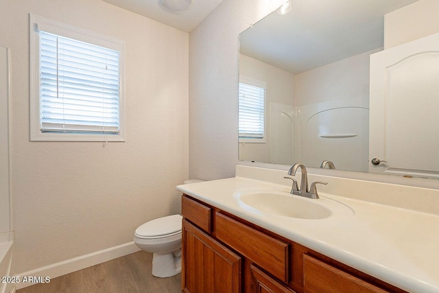 18123 W Lundberg St, Surprise, AZ 85388 - full bath with vanity, wood finished floors, toilet, baseboards, and a shower