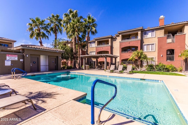 view of swimming pool featuring a patio area