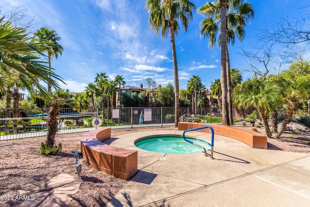 view of swimming pool with a community hot tub