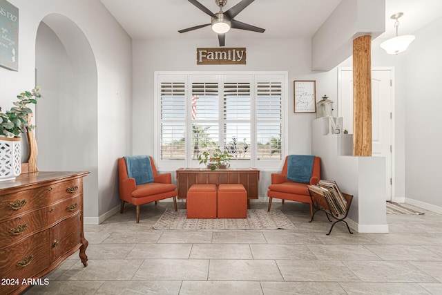 sitting room featuring ceiling fan