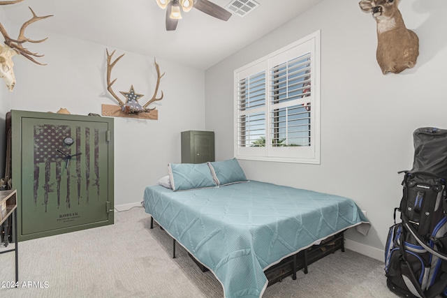 bedroom featuring ceiling fan and light colored carpet