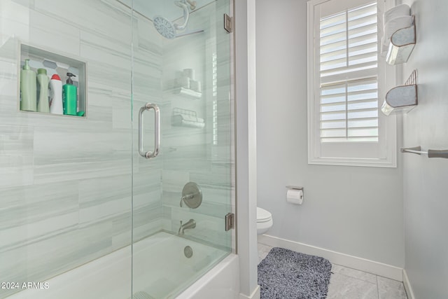 bathroom with tile patterned flooring and toilet