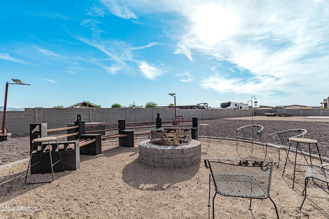 view of yard featuring an outdoor fire pit