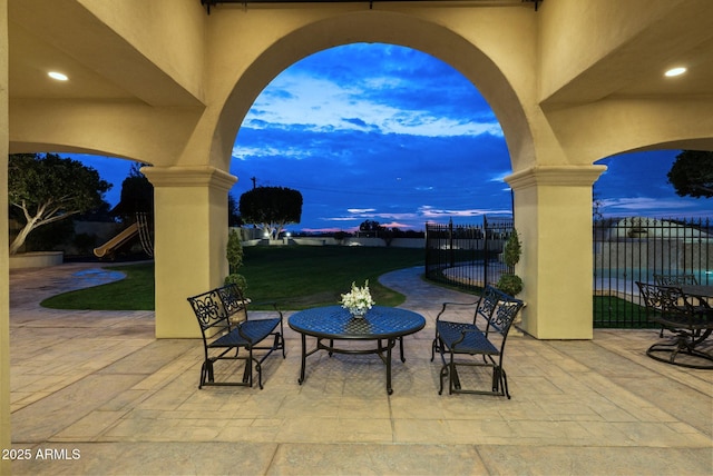 patio terrace at dusk with a playground