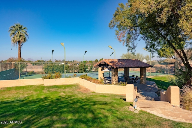 surrounding community with a gazebo, a yard, and tennis court