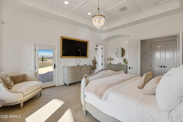 bedroom featuring coffered ceiling, an inviting chandelier, light carpet, access to outside, and a towering ceiling