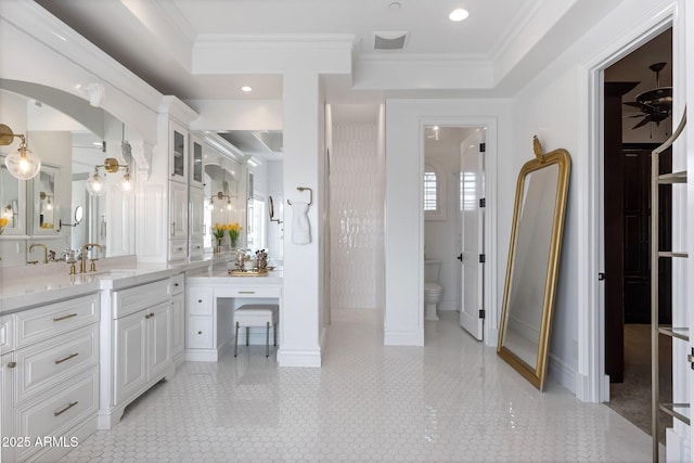 bathroom featuring vanity, ceiling fan, toilet, crown molding, and tile patterned floors