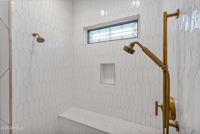 bathroom with tiled shower