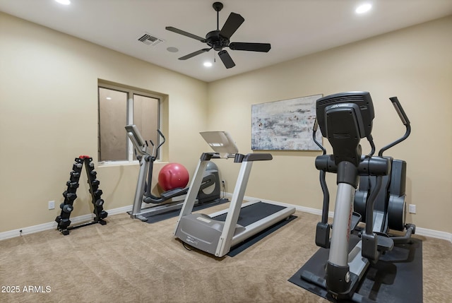 workout room featuring light carpet and ceiling fan