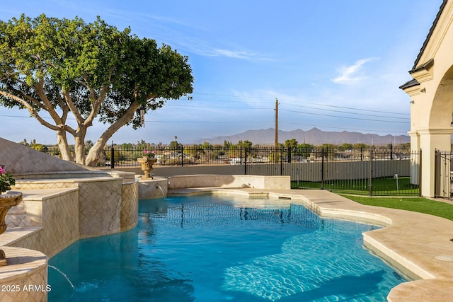 view of pool featuring pool water feature and a mountain view