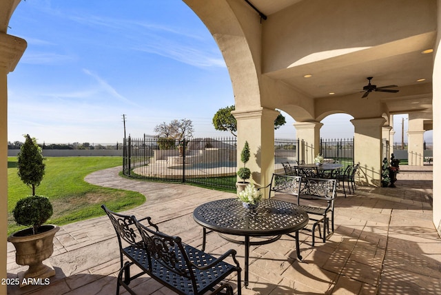 view of patio featuring ceiling fan