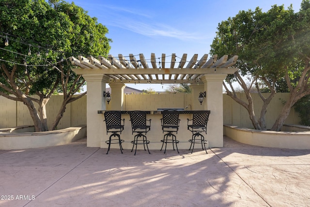 view of patio featuring exterior bar