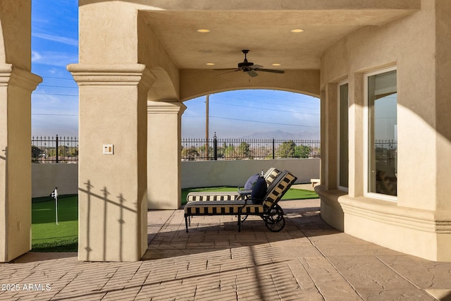 view of patio featuring ceiling fan