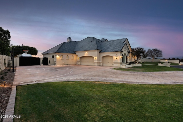 french country style house with a lawn