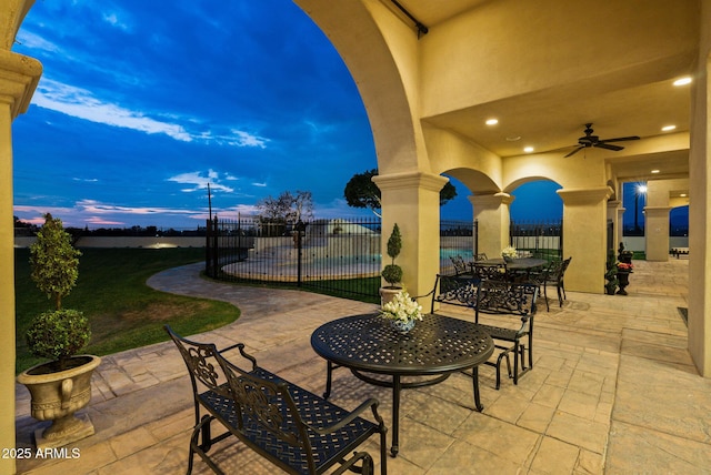 patio terrace at dusk with ceiling fan